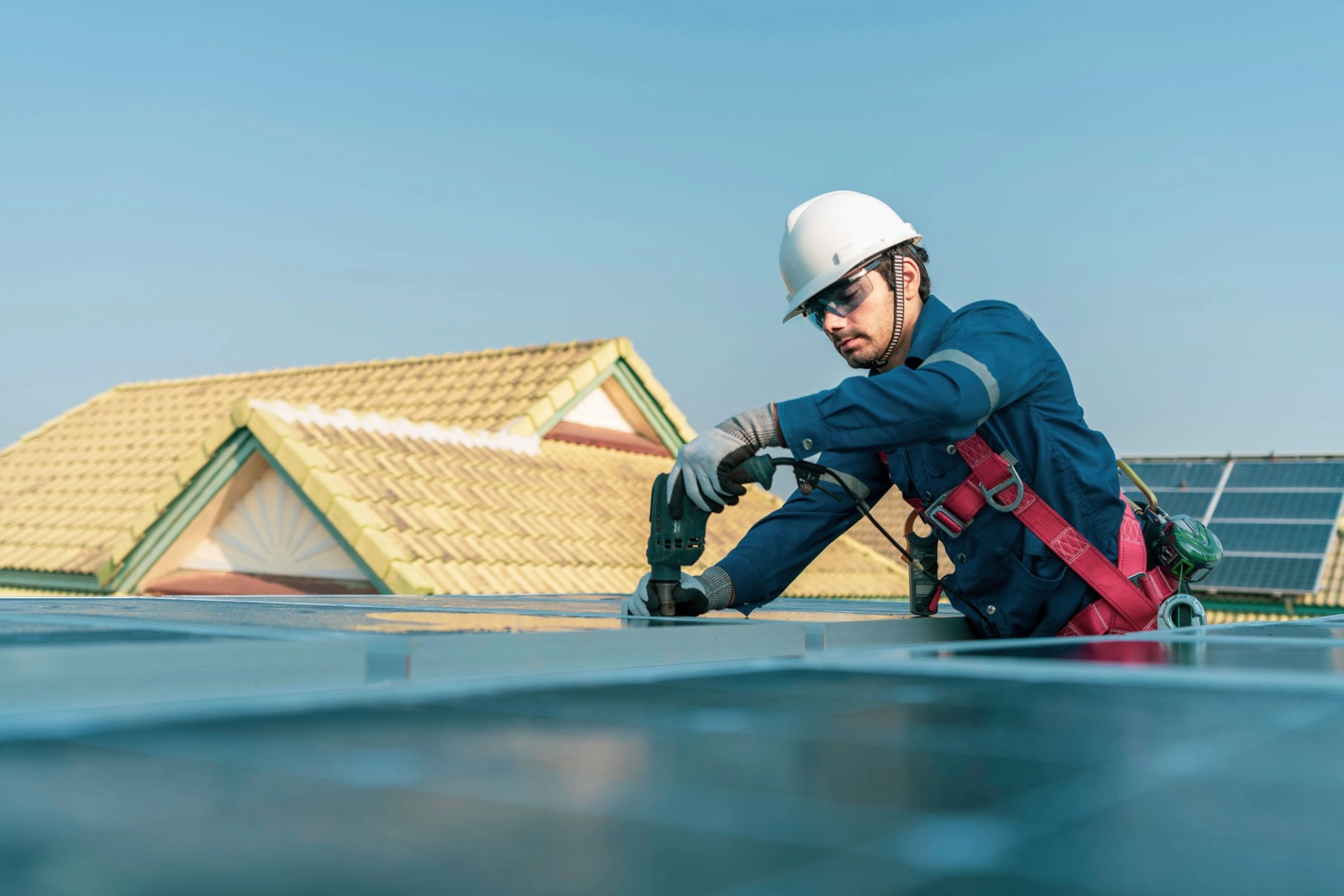 Professional roofing team demonstrating proper repair techniques with safety equipment
